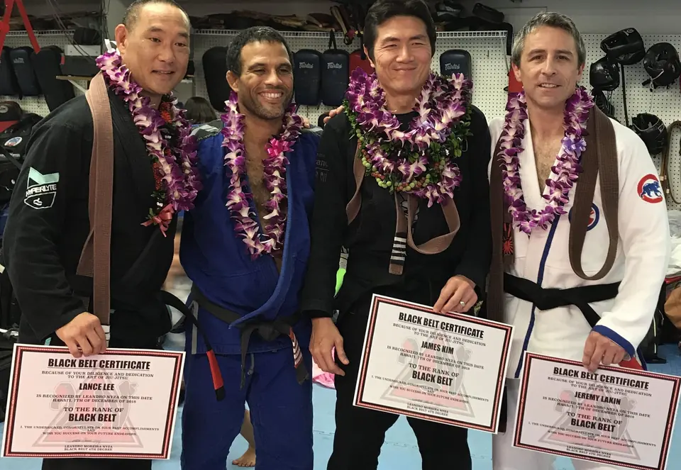 New black belts with their certificates at HMC